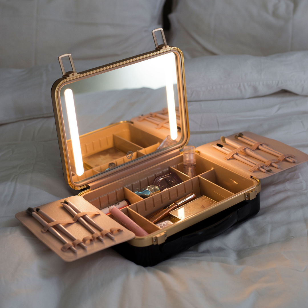 Portable makeup case with built-in LED mirror and organized beauty products inside